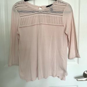 Light pink blouse with delicate detailing. Super cute!